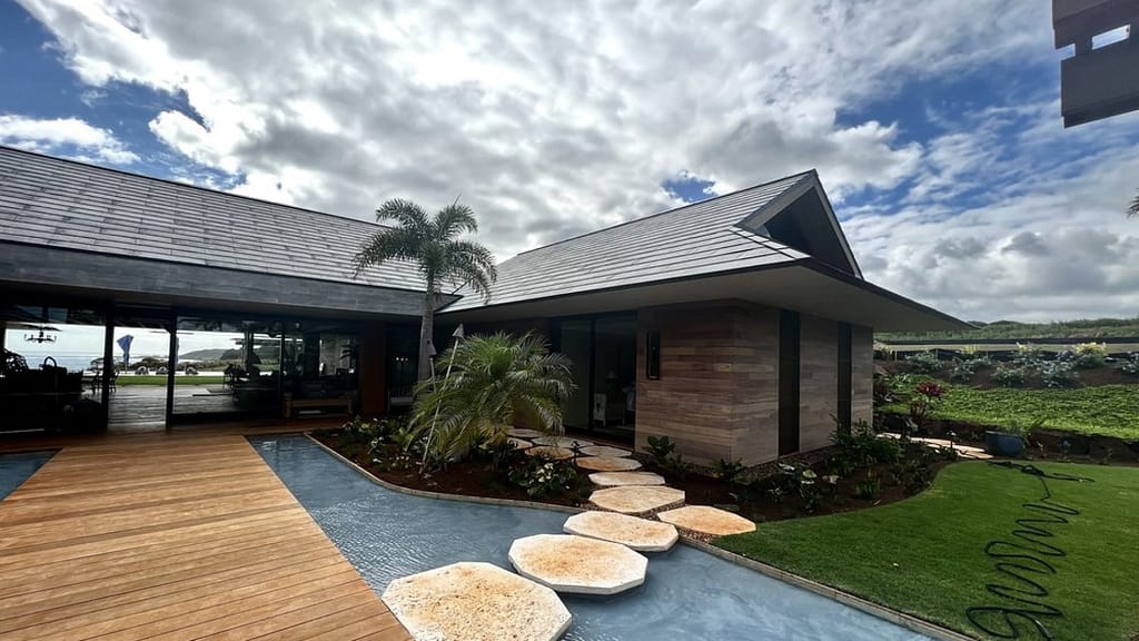 big yard and house with solar roof