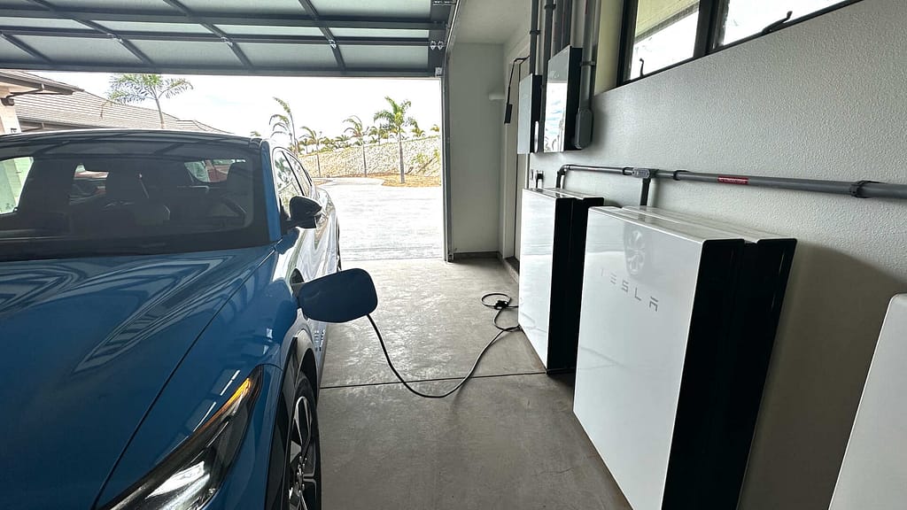 electric blue vehicle charging at home