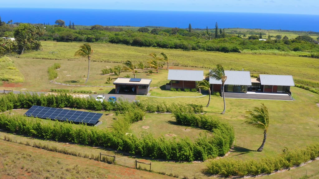 houses on field with solar system expansion