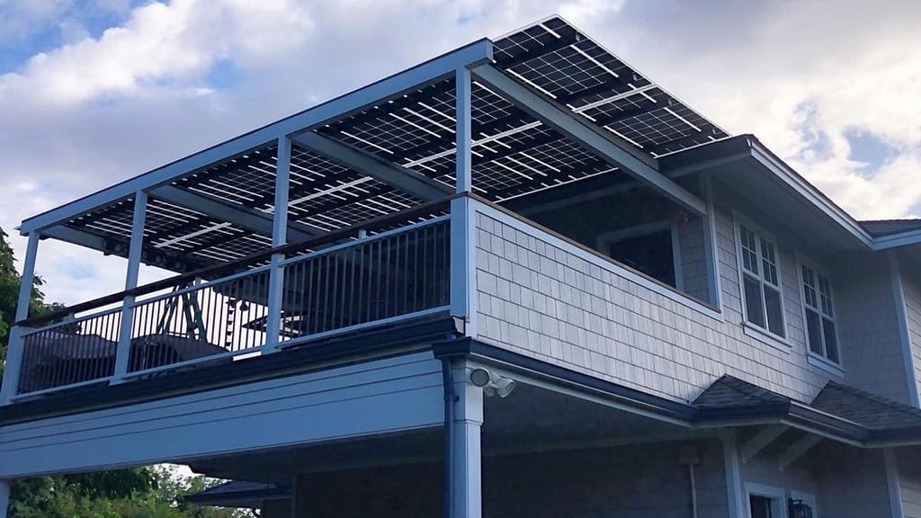 gray and white house with solar roof