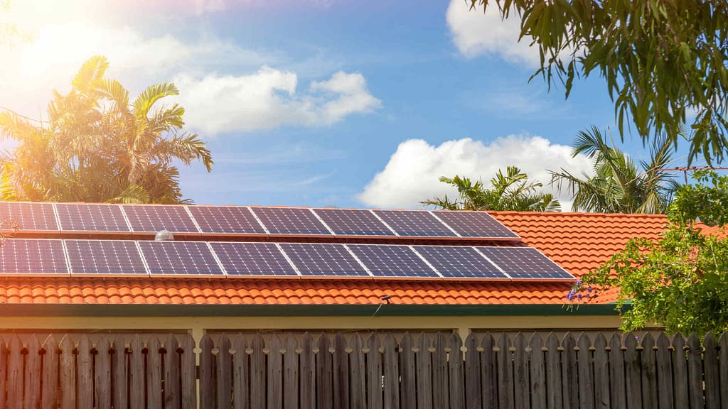 sunlight and orange roof with solar panels