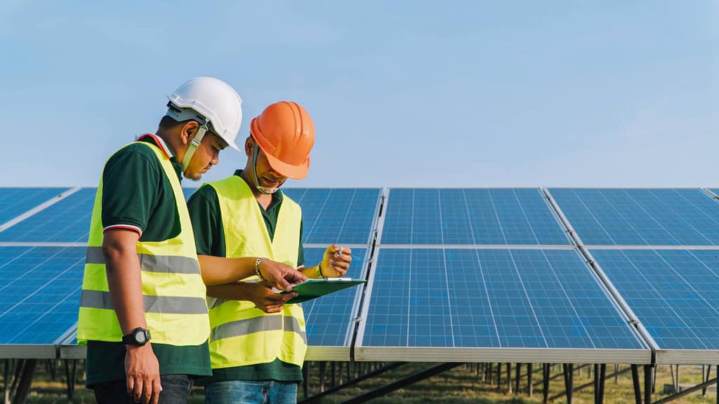 two professionals checking permits and requirements